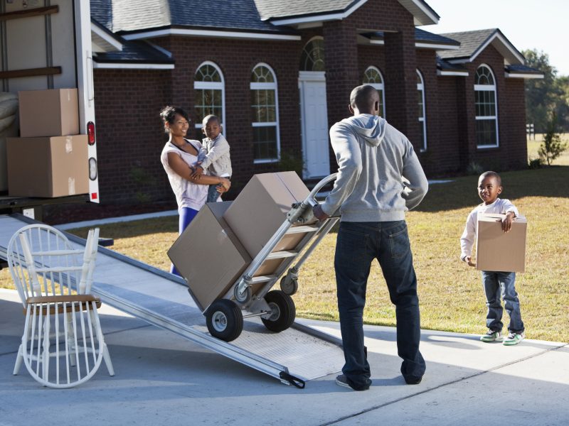 Family-Unloads-Moving-Truck