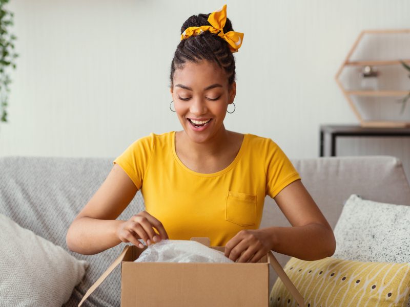 Woman-Unpacking-Moving-Present